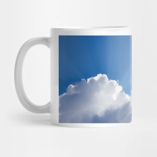 Sun rays shining behind cloud in the sky Mug